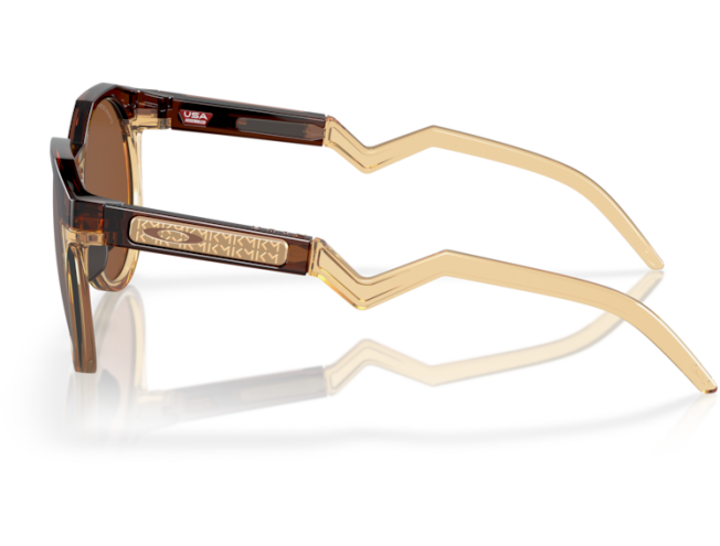 OAKLEY Htsn (52) Kylian Mbappé Dark Amber/Light Curry Prizm Tungsten